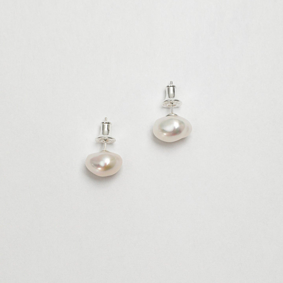 925 Sterling Silver Freshwater Pearl Stud Earrings featuring lustrous natural freshwater pearls with sterling silver posts and silicone push backs on a clean white background.