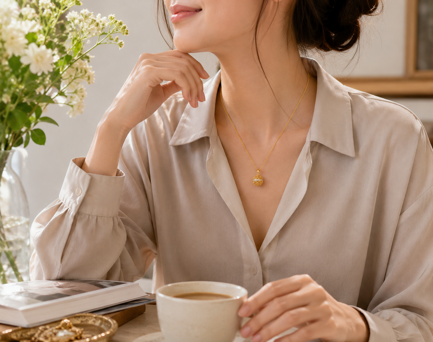 18K gold plated 925 sterling silver Harmony Ball necklace worn with a neutral everyday outfit