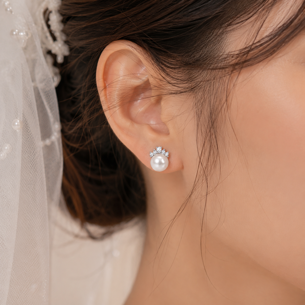Bride wearing 925 sterling silver freshwater pearl crown stud earrings.