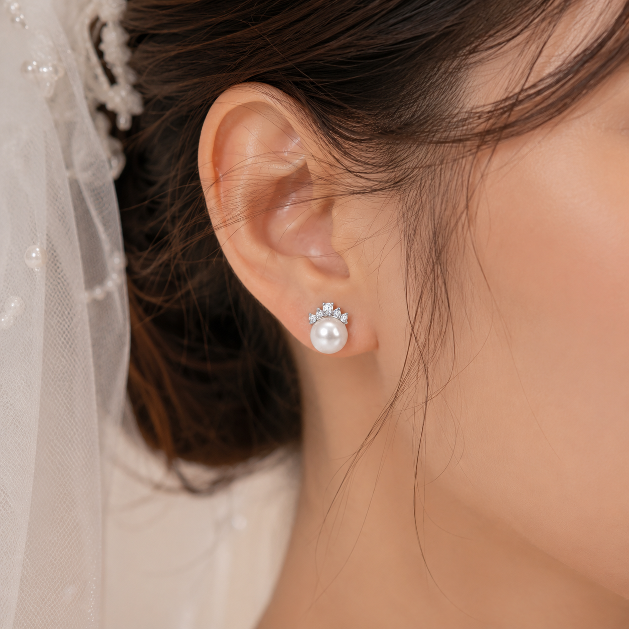 Bride wearing 925 sterling silver freshwater pearl crown stud earrings.