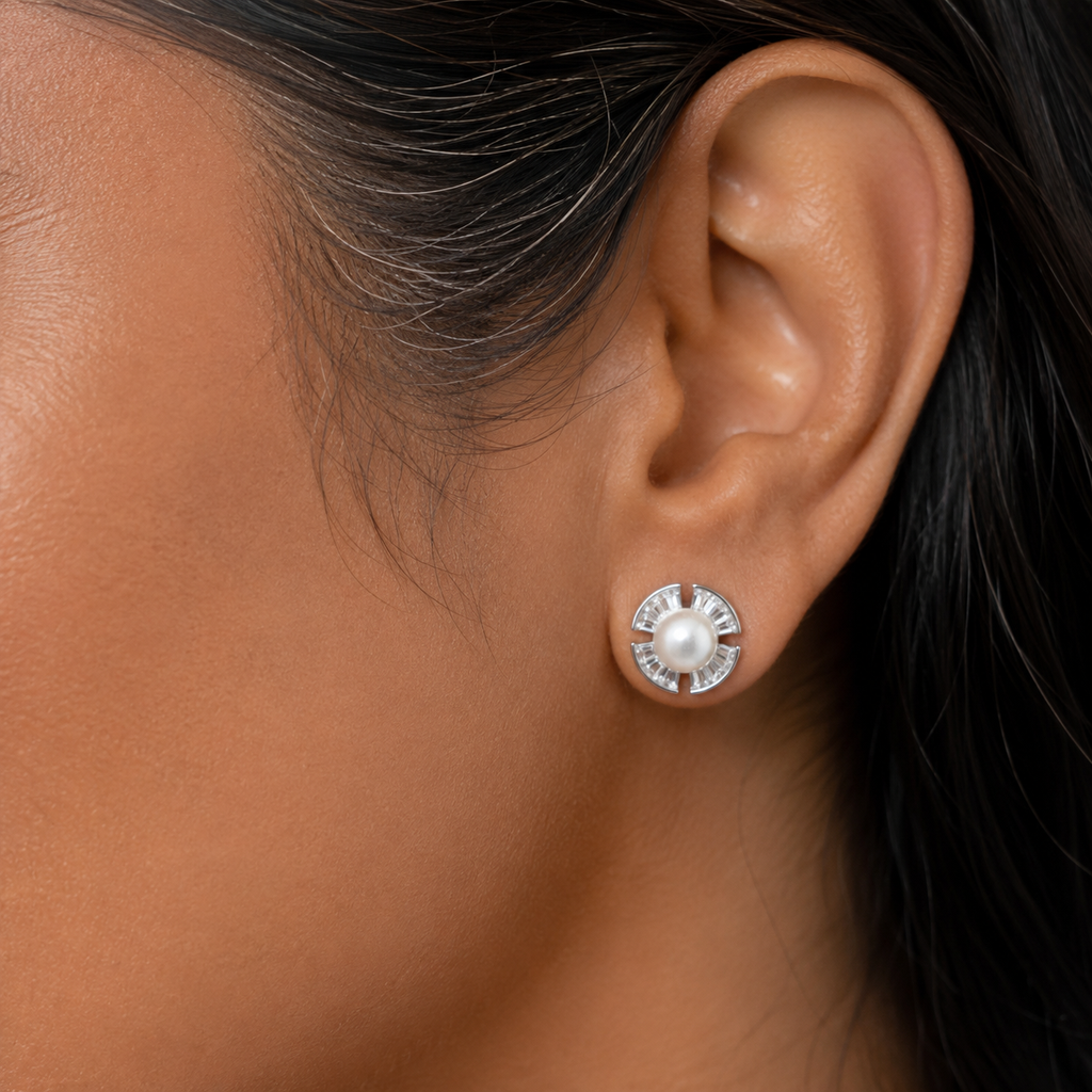 40+ Indian woman wearing 925 sterling silver freshwater pearl stud earrings on her left ear.