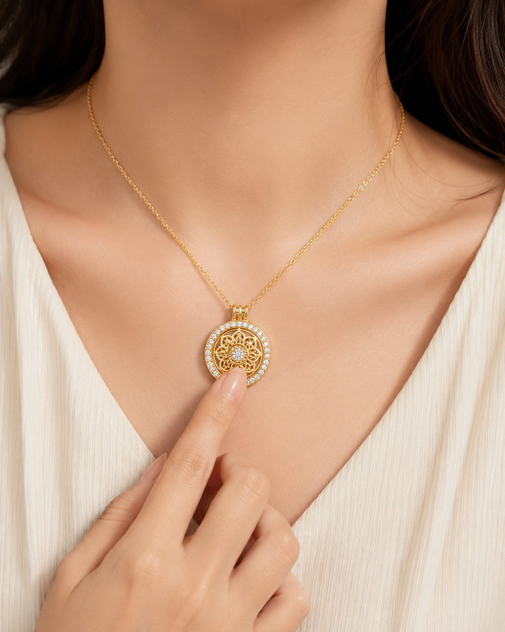 Gold plated 925 sterling silver mandala spinner necklace worn with finger touching the rotating centre