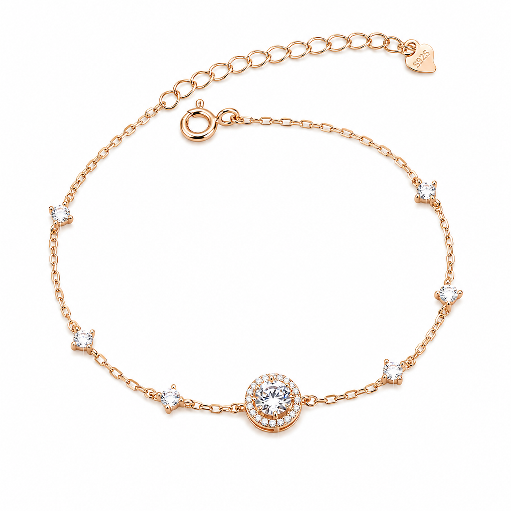 925 sterling silver rose gold plated halo CZ station bracelet featuring a round centre stone with a pavé halo and bezel-set moissanite accents, offering brilliant sparkle and timeless elegance.