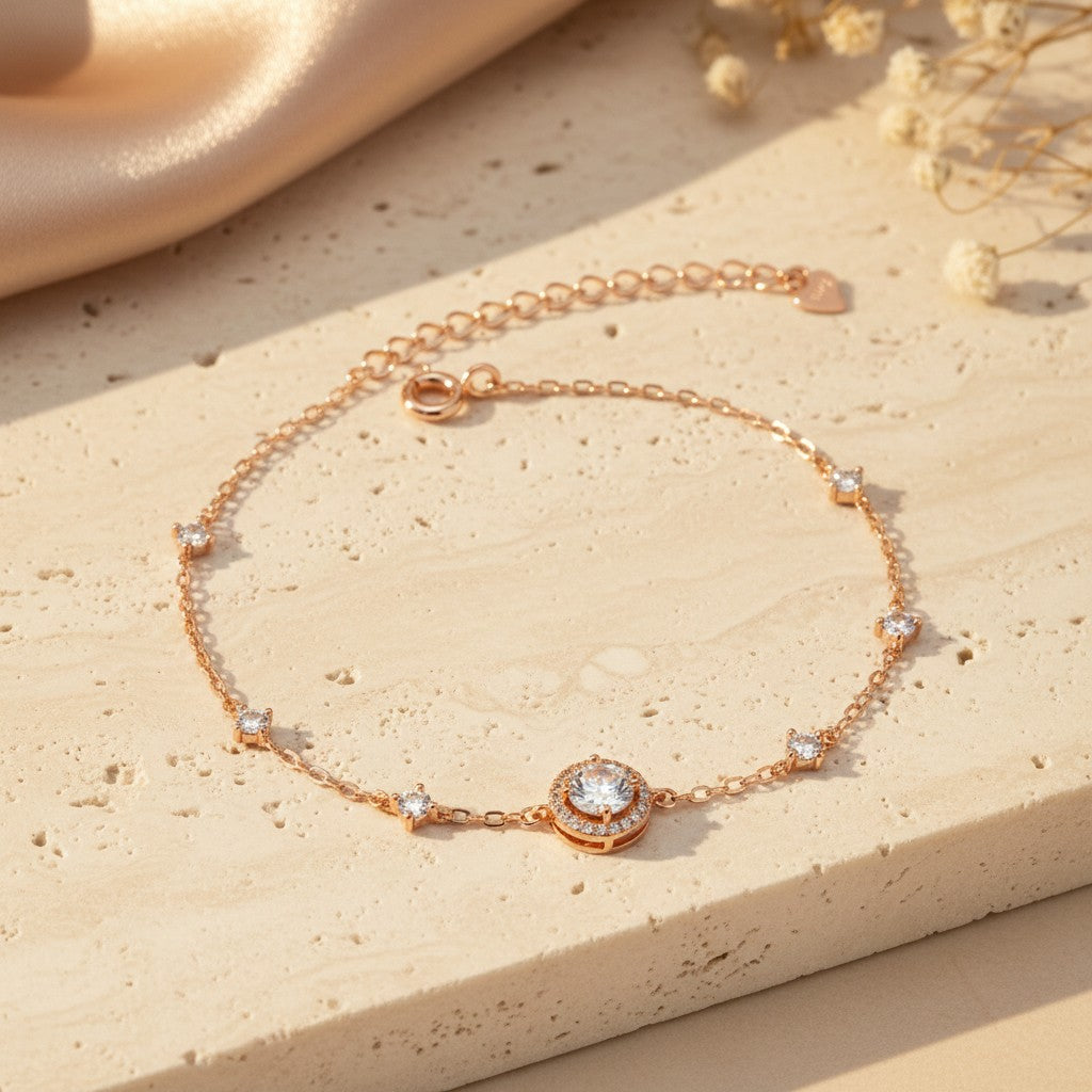 925 sterling silver rose gold round cubic zirconia halo bracelet displayed on a warm neutral stone surface