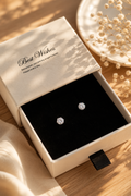 925 sterling silver round cubic zirconia stud earrings presented in an elegant gift box with soft natural sunlight, creating a luxurious flat lay perfect for gifting and everyday wear.