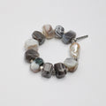 Handmade bracelet with faceted Botswana agate stones and baroque pearl accent