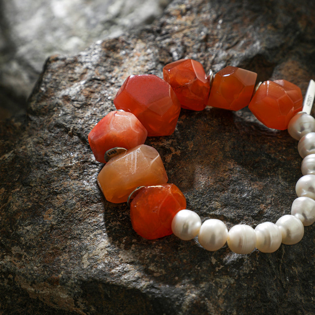 Carnelian and freshwater pearl statement bracelet styled on natural rock