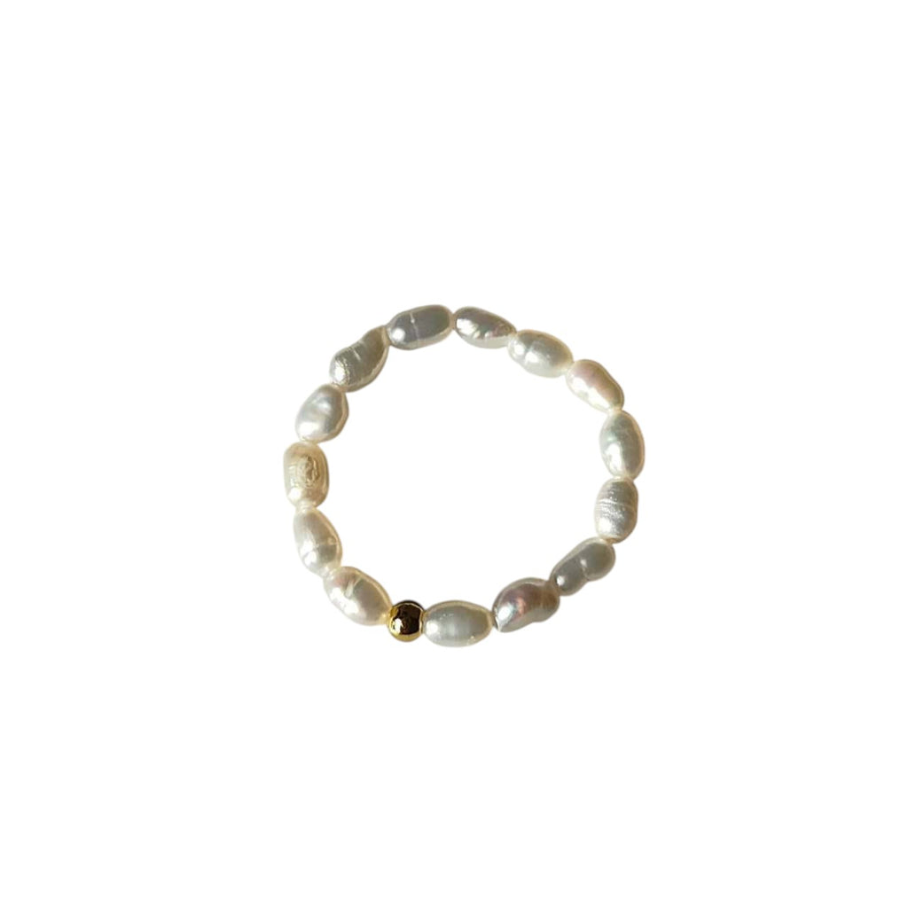 Freshwater Pearl Stretch Beaded Ring featuring natural rice-shaped freshwater pearls with a gold-tone accent bead on a comfortable elastic band.