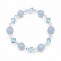 Handmade bracelet featuring natural aquamarine beads, blue faceted crystal beads, aurora crystal accents and silver-tone spacer beads on a white background.