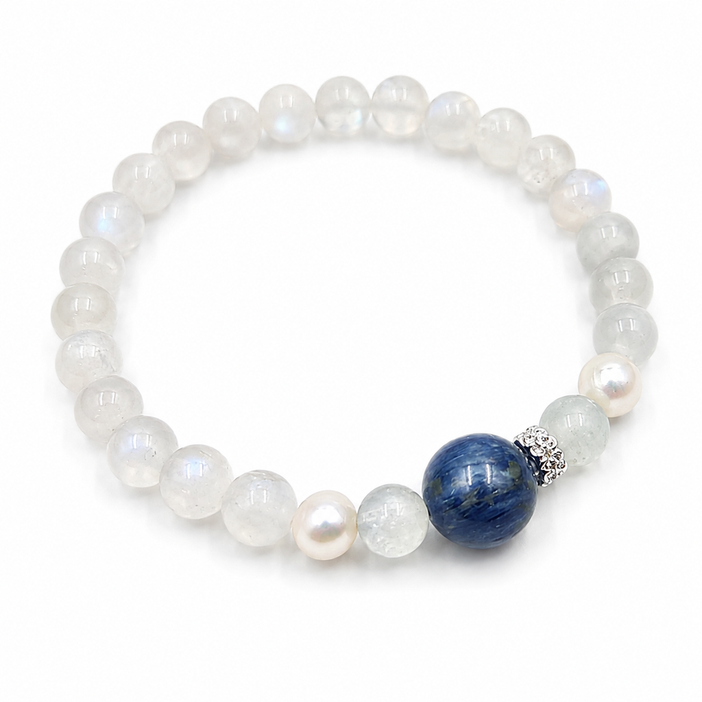 Handmade bracelet featuring natural 5mm moonstone beads, a 10mm blue kyanite focal bead and 7mm freshwater pearls.