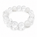 Handmade bracelet featuring 10mm natural white phantom quartz beads, 10mm clear quartz beads, 10mm faceted clear quartz cube beads and a clear floral spacer bead on a white background.