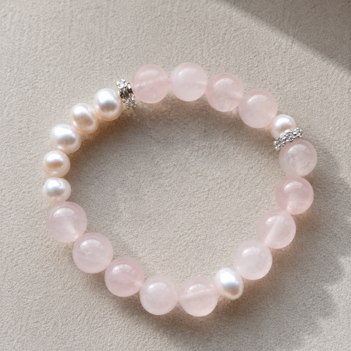 Detail of rose quartz beads, freshwater pearls and silver-tone accents